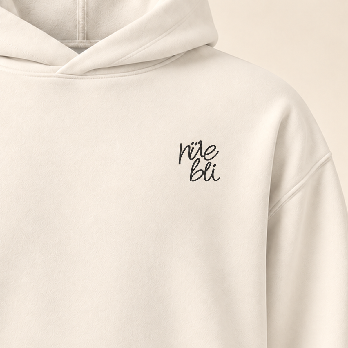 Hoodie rüebli — Argovie — bone — gros plan inscription devant (recadrage) — manuscrit