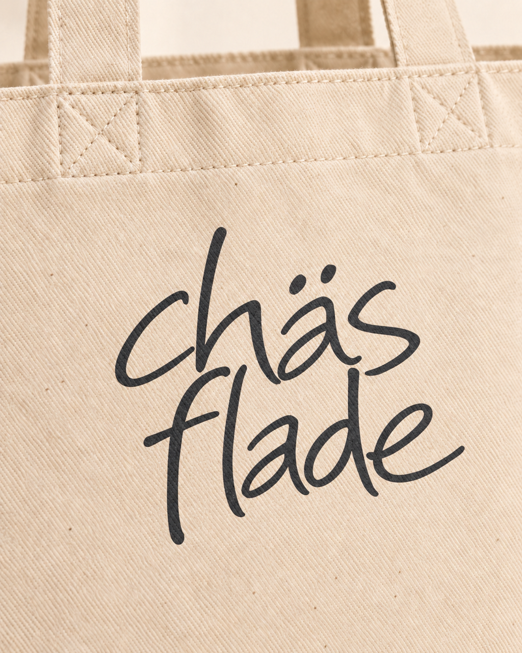 Tote bag chäsflade — détail du mot et de la toile — manuscrit